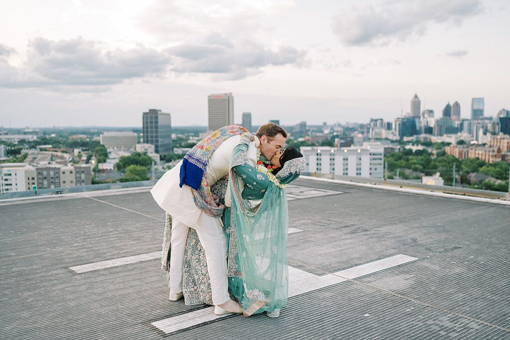 Bride and groom pictures on Ventanas Helipad Rooftop in Atlanta at sunset.